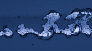 3D optical image of scratch track showing complete coating delamination and full exposure of substrate surface