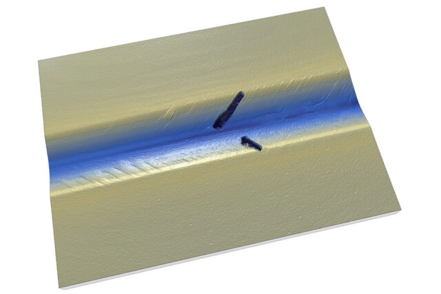 Scratch test showing the critical load for failure of a diamond-like carbon (DLC) coating.
