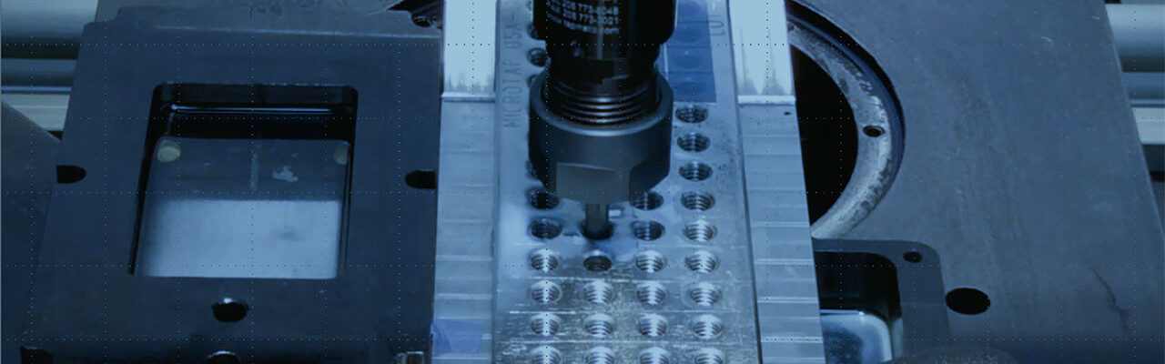Tapping torque tester measuring thread forming and cutting torque for fasteners and engineering materials.